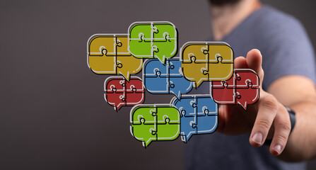 Concept of communication, teamwork, and connection presented through colorful puzzle pieces inside speech bubbles, a visual metaphor for ideas.