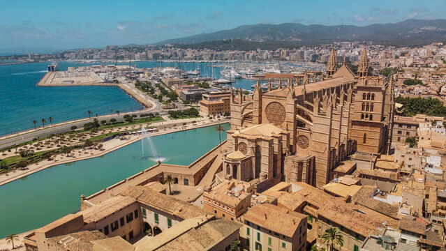 An Aerial View of Palma de Mallorcas Stunning Cathedral Alongside its Picturesque Harbor