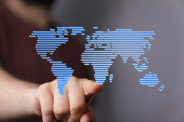 Hand pointing at digital world map.  Global network, technology, connection concept.