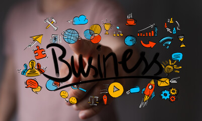 A hand interacts with a virtual display of diverse business icons, representing strategy, innovation, and global growth. Ideal for digital conce