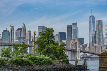 Naklejka premium Manhattan skyline with One World Trade Center and Brooklyn Bridge seen from Dumbo, Brooklyn, New York City.