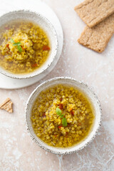 Homemade lentil soup served with basil