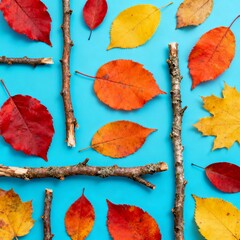 Autumnal Arrangement of Leaves and Twigs on a Blue Surface