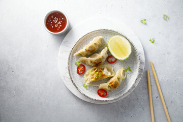 Fried dumplings with chili sauce