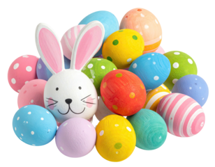 A cute Easter bunny figurine sits with a pile of brightly painted Easter eggs