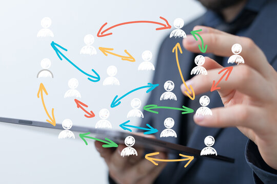 Businessman using tablet to manage connections, networking, global reach, teamwork, collaboration, strategy.