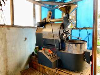 Vintage coffee roaster in operation, capturing the essence of artisanal coffee making for cafe or business use