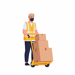 A person wearing a mask and safety vest is moving boxes on a hand truck.