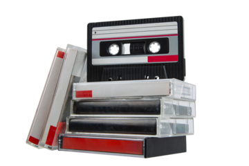 Stack of vintage music cassette tapes collection.