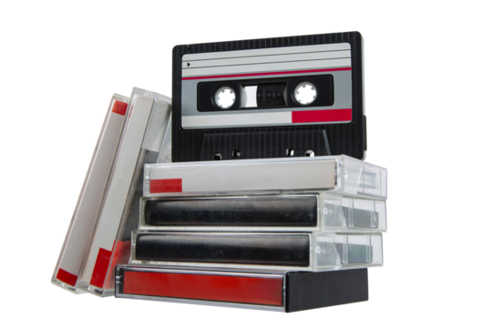 Stack of vintage music cassette tapes collection.