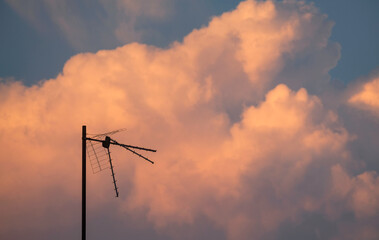 Antenna with a beautiful sunset sky background at dusk
