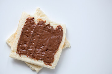 Close-up of white bread with chocolate jam