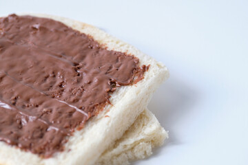 Close-up of white bread with chocolate jam