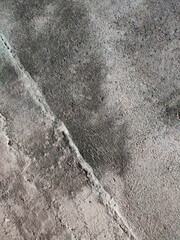 the background and texture of the wall are rough and unpainted