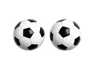 Obraz premium Two classic soccer balls, black and white, sit side by side against a black backdrop