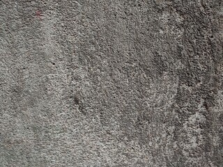 the background and texture of the wall are rough and unpainted