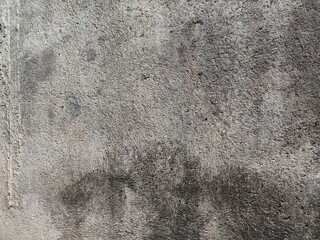 the background and texture of the wall are rough and unpainted