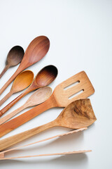 Wooden kitchen utensils isolated on white background