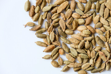Organic dried green cardamom pods isolated on a white background