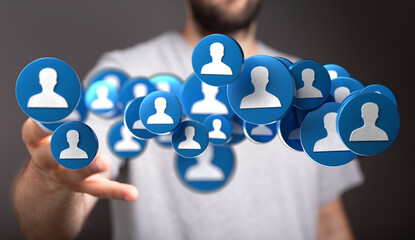 Stock photo of a hand reaching for digital profile icons. Ideal for social media, networking, and...