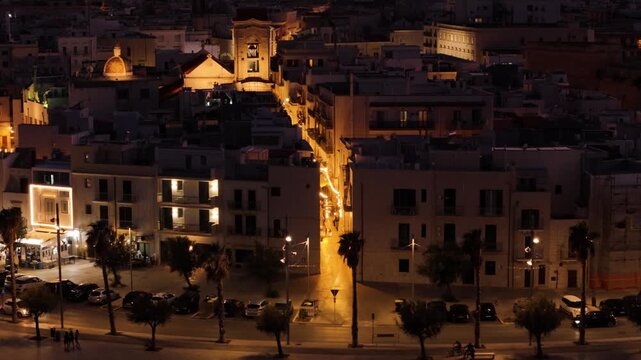 Night colors of Italian coast township, aerial view
