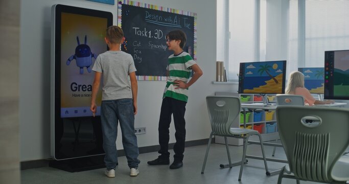 Schoolboy Uses Interactive Digital Screen, Talks Classmate. Boys Study STEM Classroom. Concept Of Integrating Educational Technologies, Social-emotional Learning Into Modern Education. Dolly Shot. - Powered by Adobe