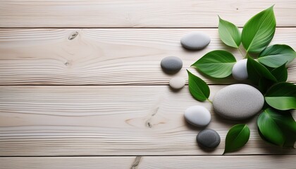 Photo Of Green Leaves And Smooth Stones On A Light Wooden Background
