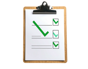 A wooden clipboard holds a checklist with green check marks