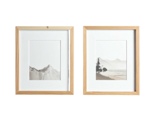Two framed landscape prints with wooden frames, set against a black background