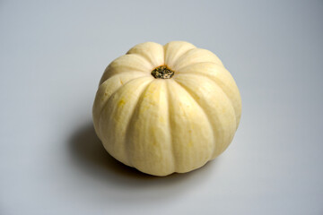 Close-up of white pumpkin indoors against white background. Photo taken September 30th, Zurich Schwamendingen, Switzerland.