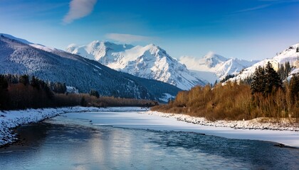 Obraz premium Snow Capped Mountains And A Frozen River Landscape Background