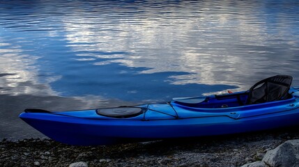 kayak. A kayak rests on the shoreline, reflecting calm blue waters in a serene natural setting. tourism brochures, itinerary planners, designed for travel destination branding.