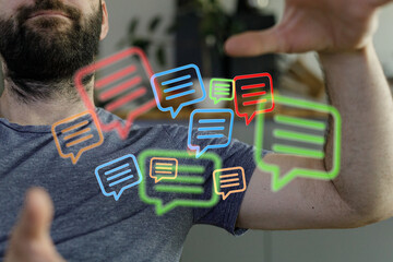 Man interacting with virtual chat bubbles, augmented reality, communication, technology concept. Trendy graphics overlayed on real life.