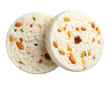 Two circular mounds of fluffy white rice studded with colorful nuts and seeds
