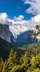 Panoramic mountain view with valley and waterfall