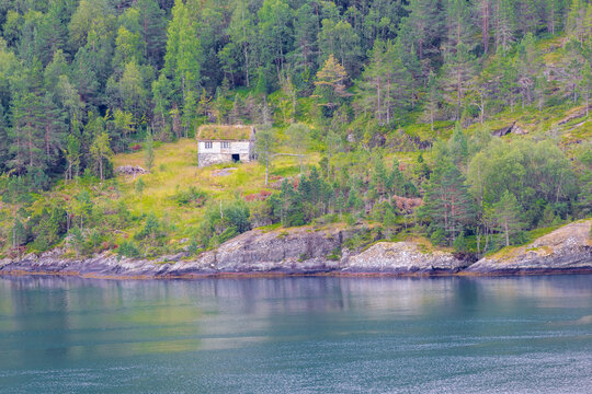 The small Norwegian village of Hellesylt, at the head of the Sunnylvsfjorden, a branch of the Storfjorden and the more famous Geirangerfjord, which is a famous cruise stop for a daytrip in the county