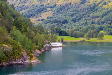 The small Norwegian village of Hellesylt, at the head of the Sunnylvsfjorden, a branch of the...