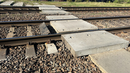 railway crossing over the tracks to the platform of a suburban train stop