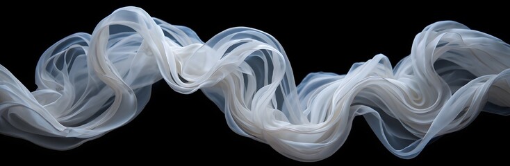 Flowing white fabric against black background creates an elegant and ethereal effect of lightness