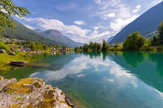 Stryn, Norway - 07-22-2025 - The picturesque village Stryn near the fameus Geiranger fjord in the beautiful Norway with authentic houses, the typical wooden bridge and amazing turquoise coloured water