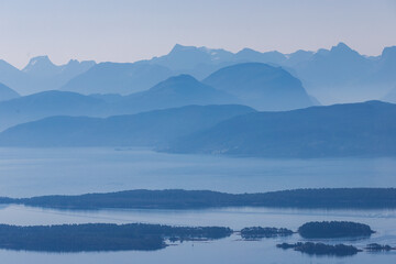 Fototapeta premium A fantastic view rom the Varden viewpoint over the Norwegian town of Molde, the fjord with the many islands and the famous panorama with over 220 peaks with most mountain tops over 1000 meters high