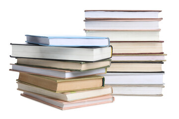 Stacks of many books isolated on white
