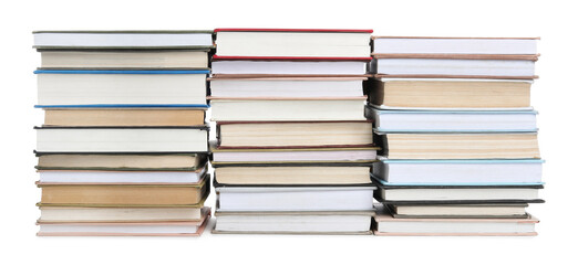 Stacks of many books isolated on white