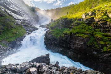 Fotobehang Watervallen The Kjosfossen waterfall, located in Aurland municipality, is legendary in Norway with a a total fall of 93 meters and it is only accessible by train. A trip on the Flåmsbana Railway takes you right p  © KimWillems