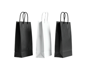 Three simple paper gift bags in black and white colors, handles visible