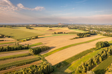 Aerial View of Patchwork Farmland and Distant Heaps, Poland &ndash; Countryside Landscape in Summer