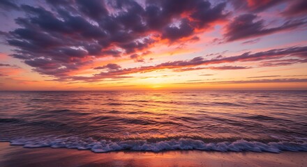 Vibrant sunset over ocean horizon with dramatic clouds and colorful sky