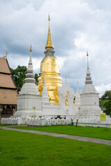 Naklejka premium Golen temple with golden padoda in Chiang Mai, Thailand. Beuatiful Lanna aricitecture.