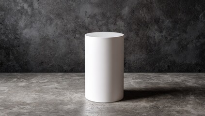 Empty cylinder-shaped display pedestal against a dark textured wall and floor, highlighting the product placement area.