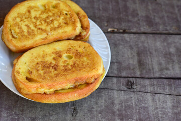 French toast  and white cheese. Rustic breakfast  made from deep fried   bread   with organic free range   eggs